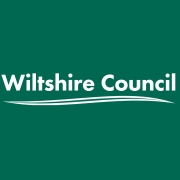 Wiltshire Council logo with white text and a curved underline on a dark green background.