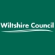 Wiltshire Council logo with white text and a curved underline on a dark green background.