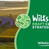 Stonehenge on a grassy plain with text: Wiltshire Draft Climate Strategy 2022-2027, Wiltshire Council.